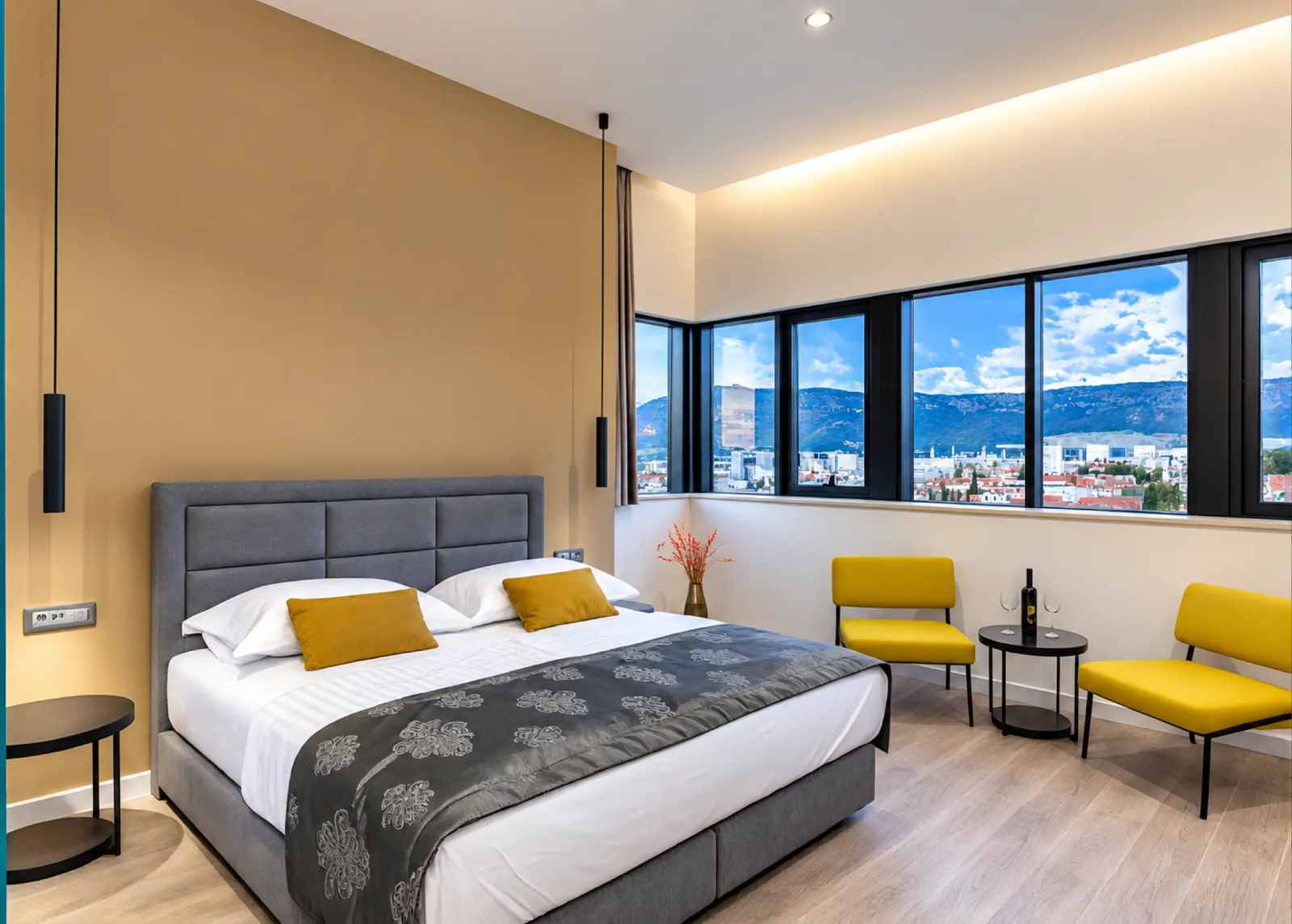 Guest room with panoramic windows over the rooftops of Split